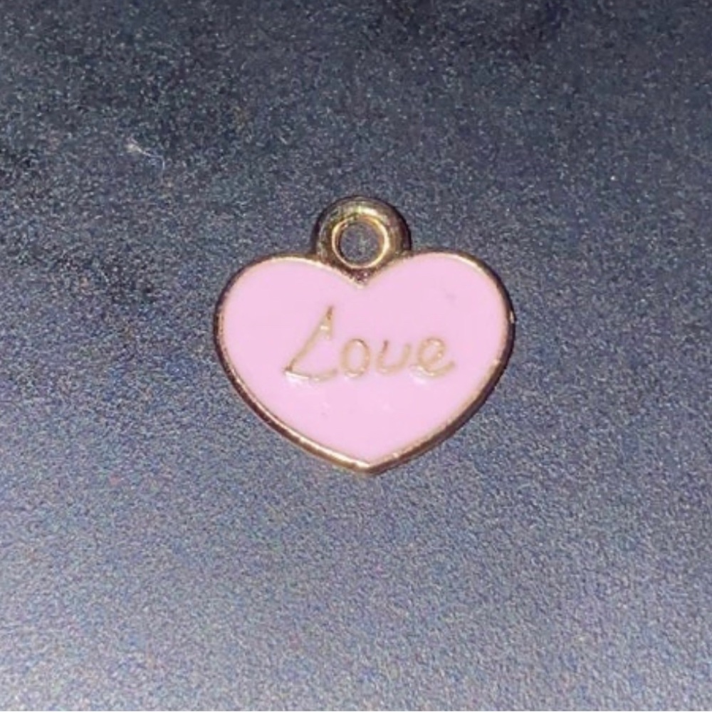Love Heart Pendant plated gold 0.6 grams 2CM wide and 2cm long good quality used